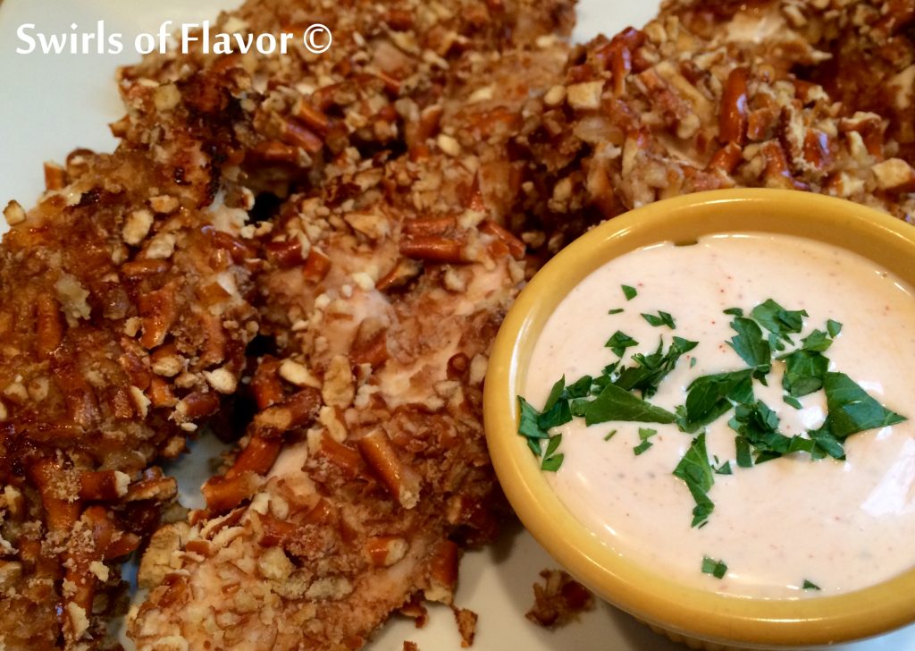 Pretzel Ranch Chicken Tenders is an easy recipe with a crunchy pretzel coating and spicy dipping sauce making them a perfect appetizer for movie night or watching the big game. Serve them with a Buffalo Ranch Dipping Sauce and this baked pretzel-crusted chicken tenders recipe will be a favorite in no time! 